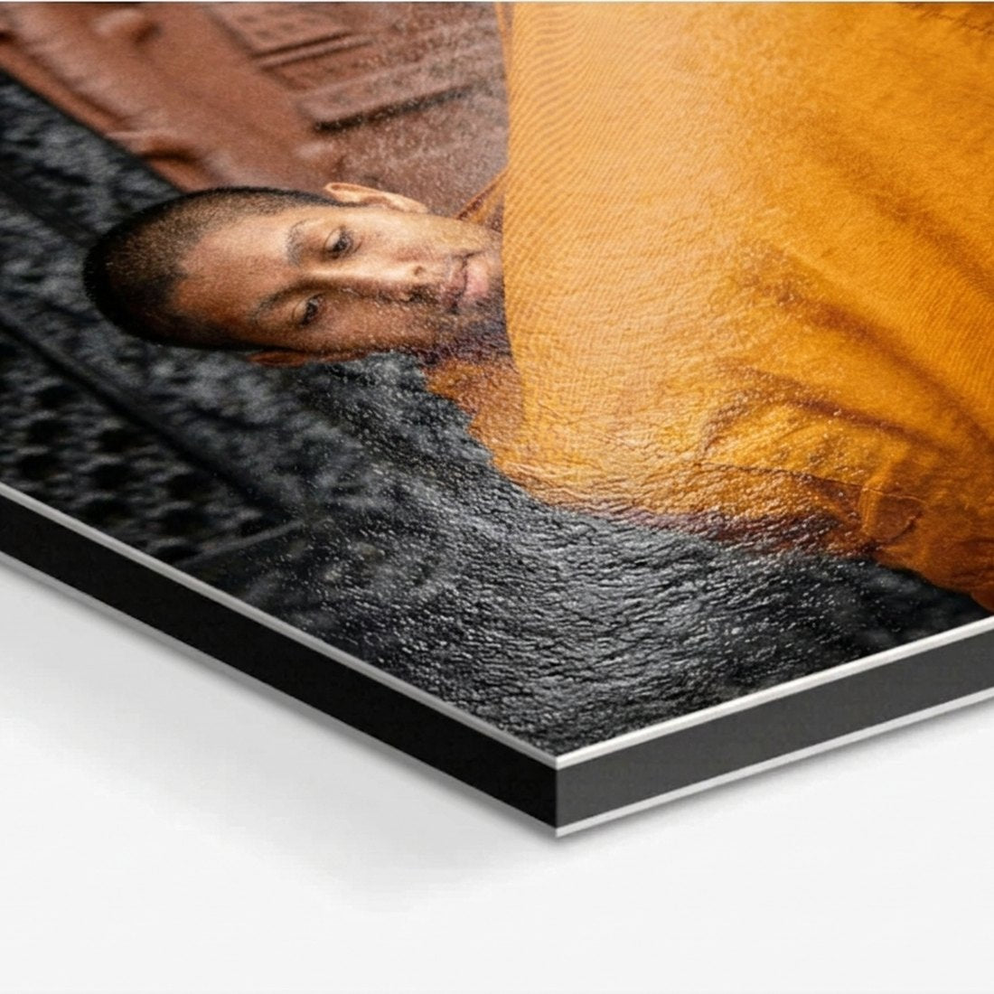 Corner of a Dibond mounted print, showing the slim aluminium panel edge