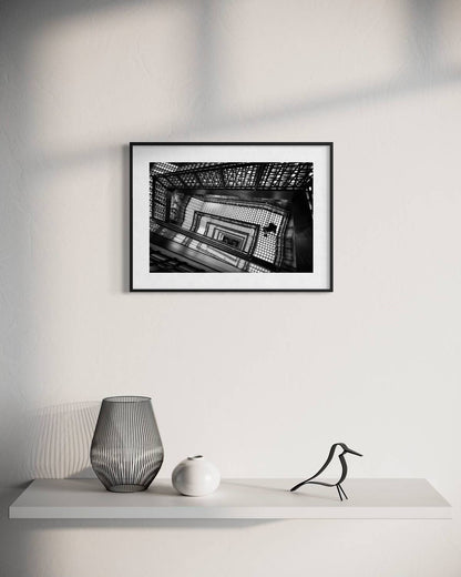 Endless ascent by Marc Estruch: black frame with white mat, 30 x 45 cm, on a wall